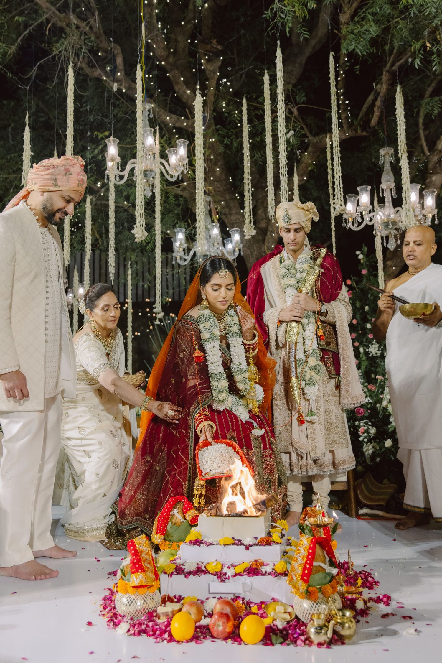 Traditional Hindu wedding ceremony with sacred fire and floral arrangements.