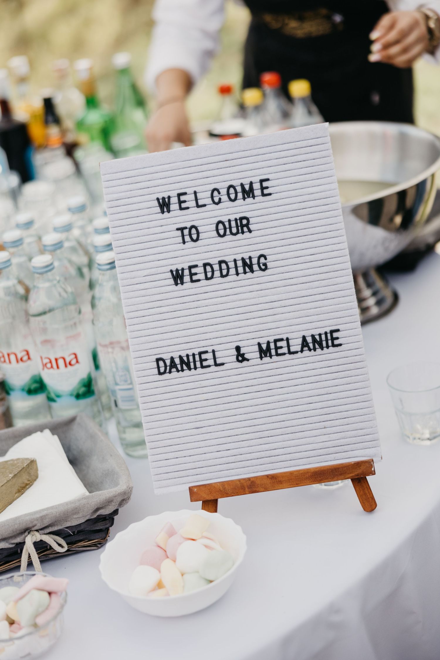 Wedding welcome sign on letter board displaying 'Welcome to our wedding Daniel & Melanie'.