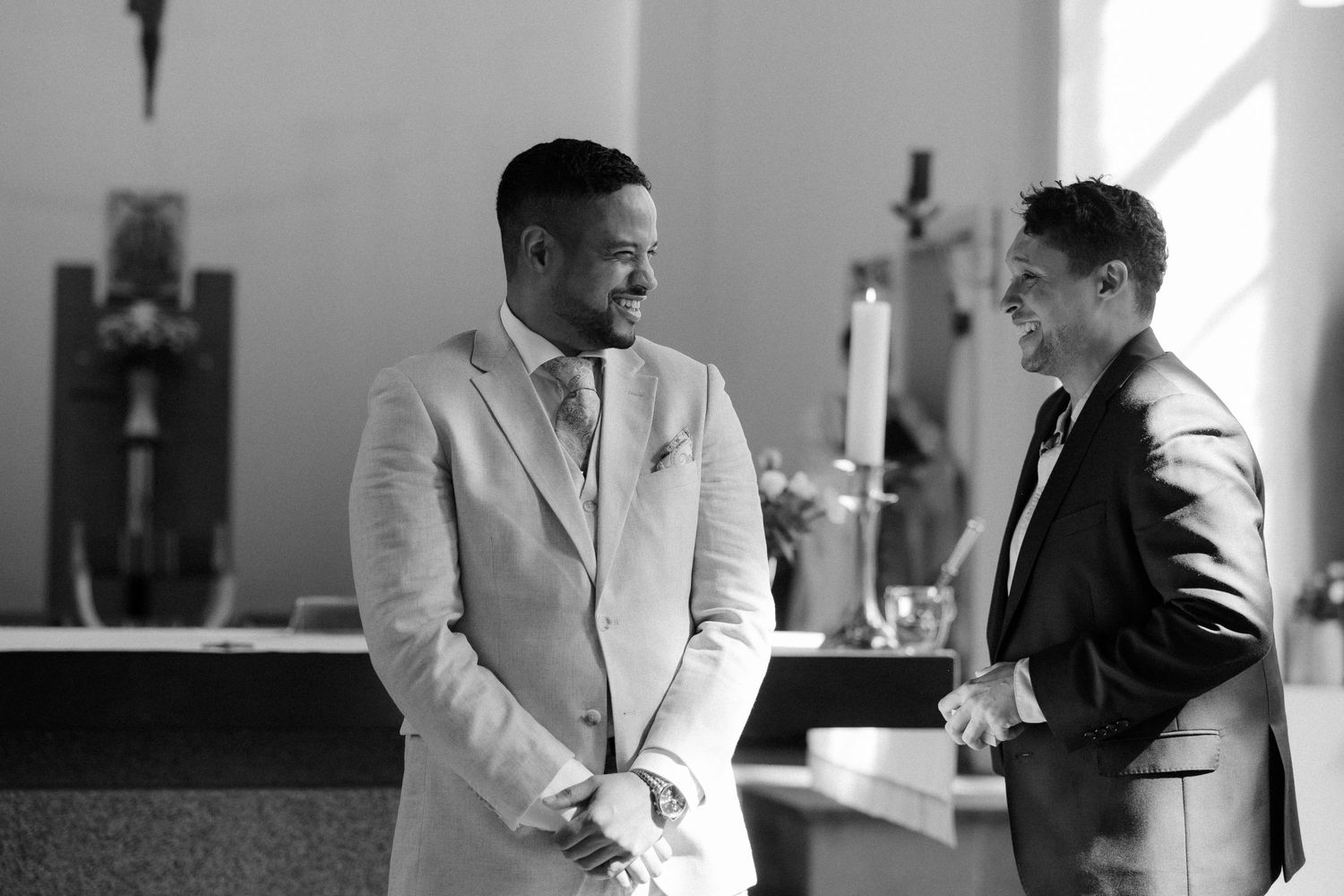Candid black and white photos of wedding party members in formal attire.