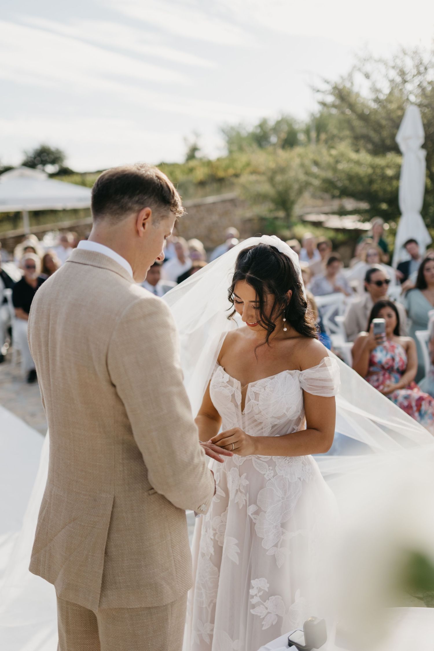 Wedding couple sharing romantic dance moment on outdoor terrace.
