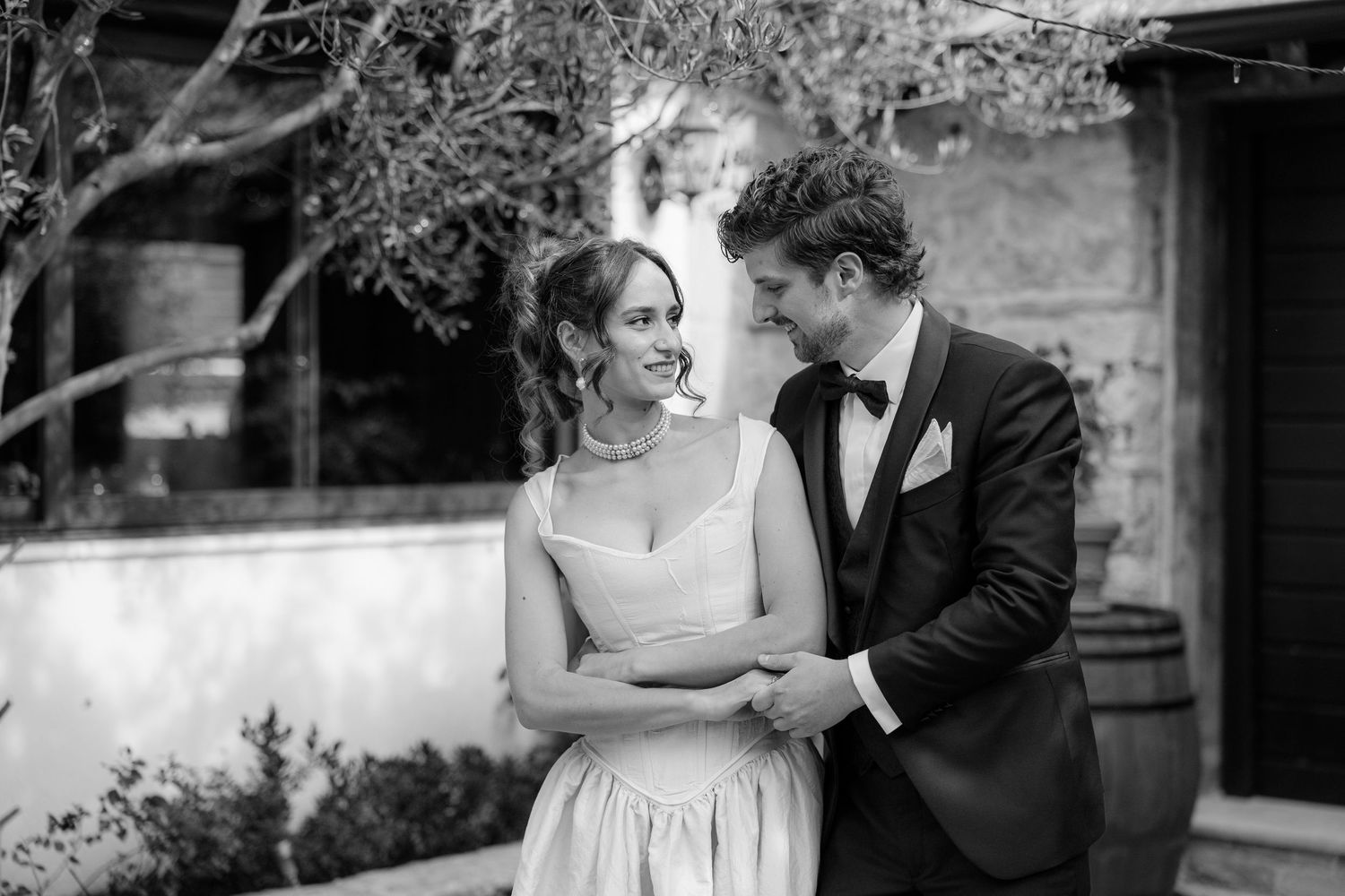 Black and white wedding sequence showing romantic moments in an outdoor setting.