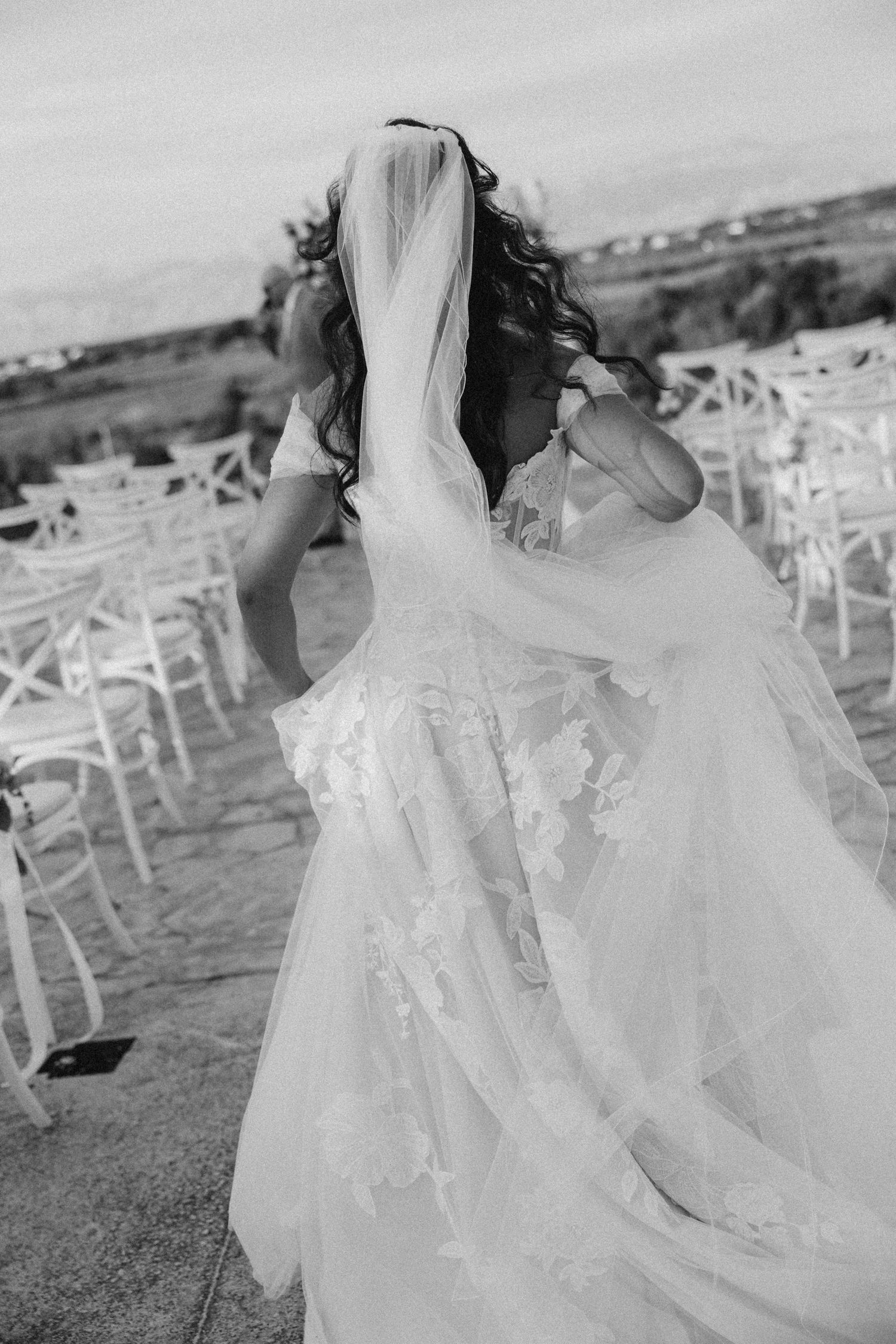 Black and white photo series of a flowing white wedding dress twirling in motion.