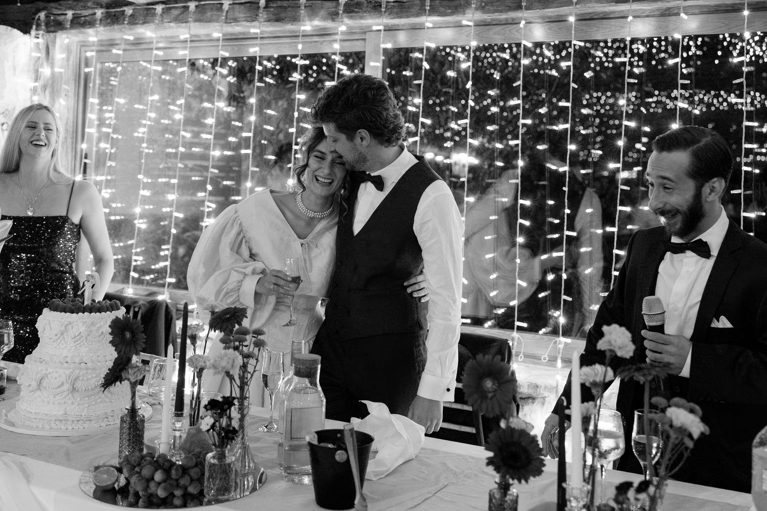 Wedding reception scene with twinkling fairy lights creating a magical atmosphere.