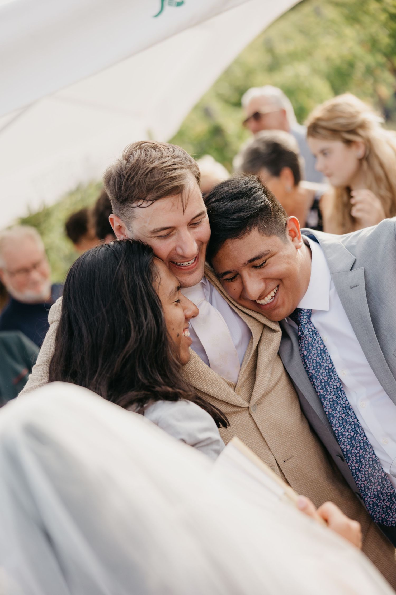 Candid shots capture genuine laughter and joy between newlyweds during their wedding celebration.