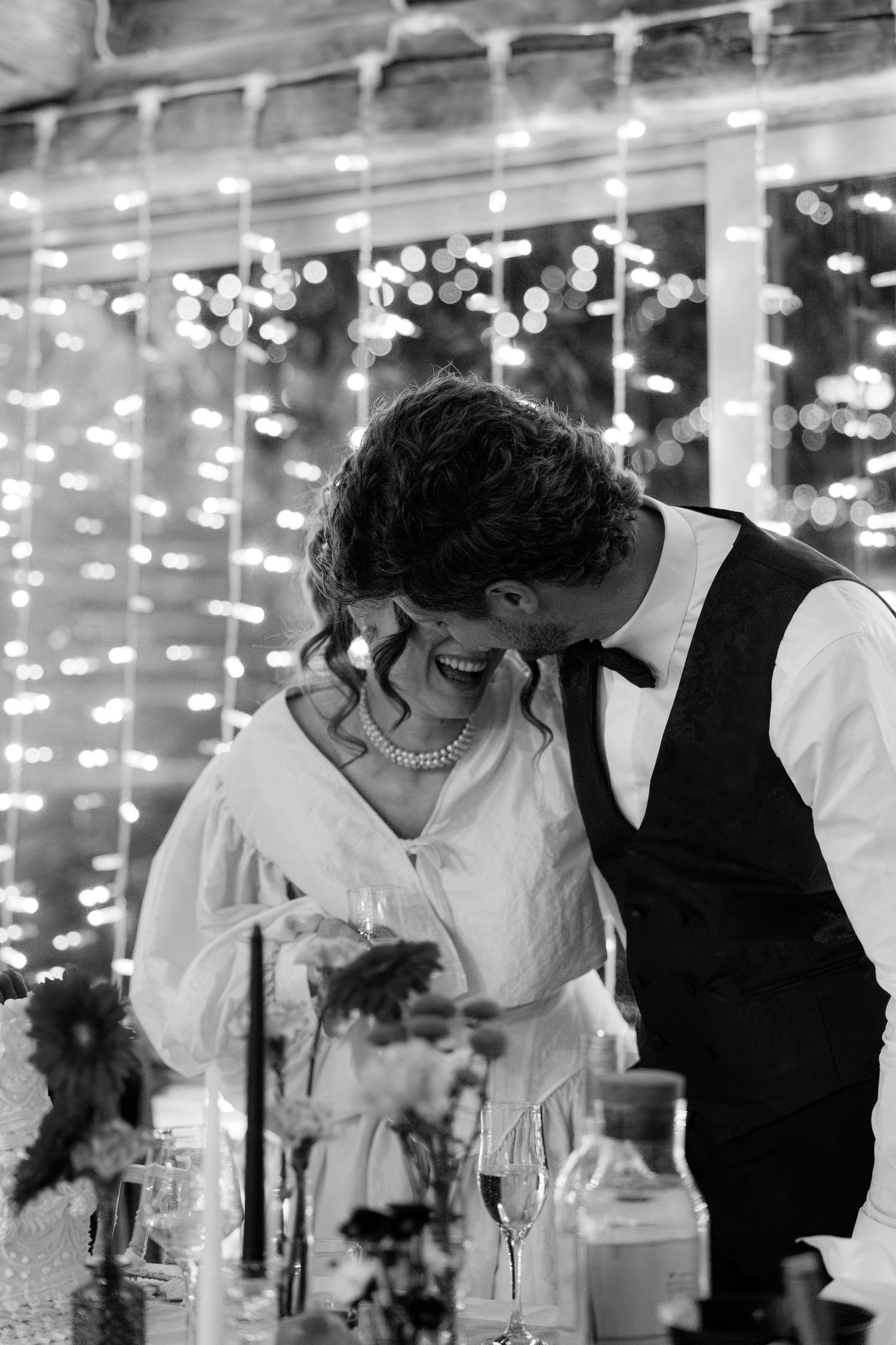 Romantic scene with string lights creating a magical atmosphere during an evening celebration.