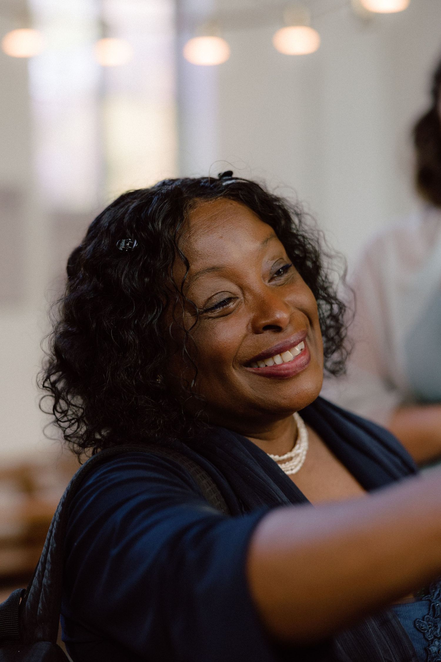 Wedding guest expressing pure joy and laughter during celebration.
