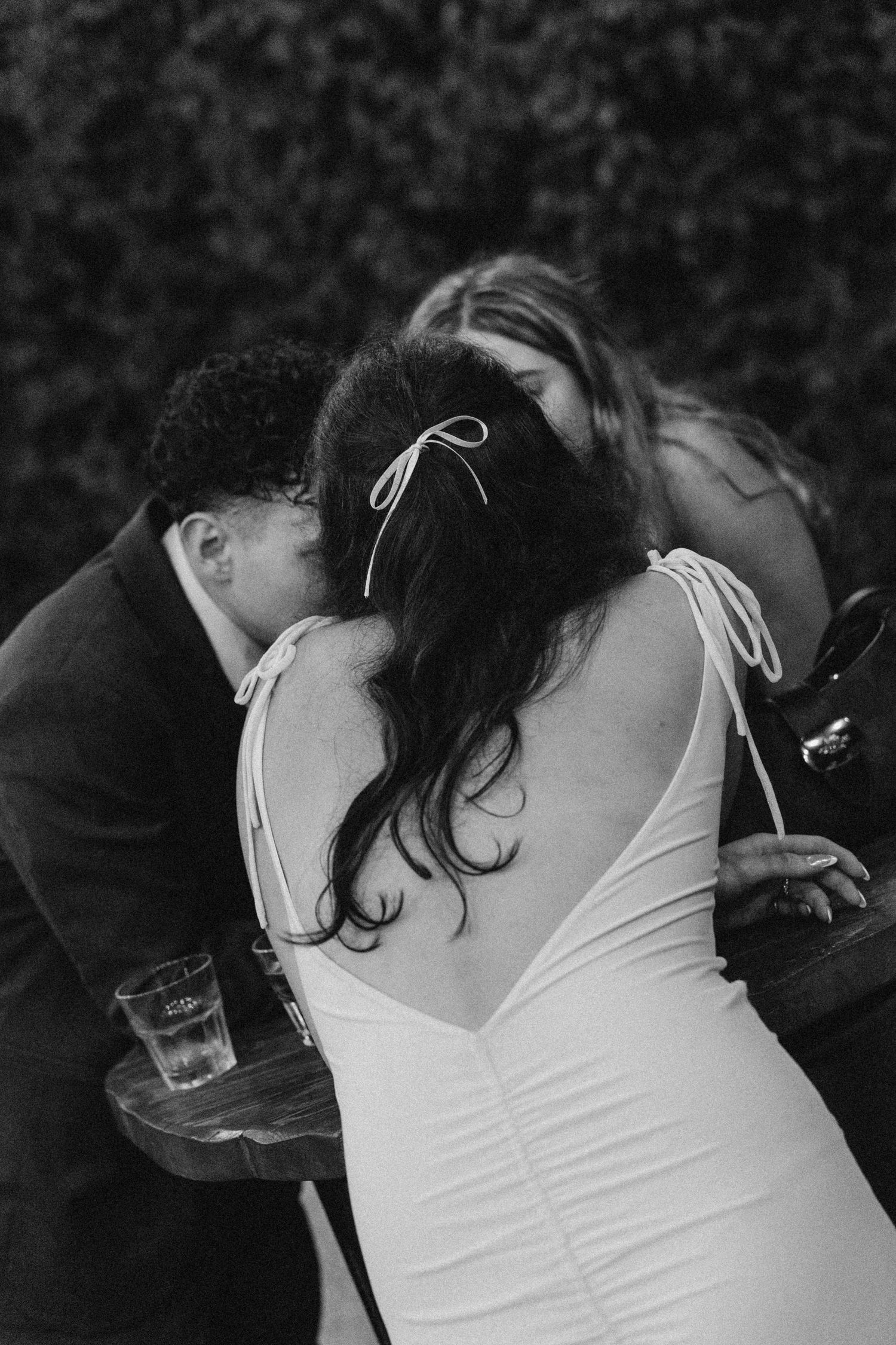 Intimate black and white dance moment captured during wedding reception.