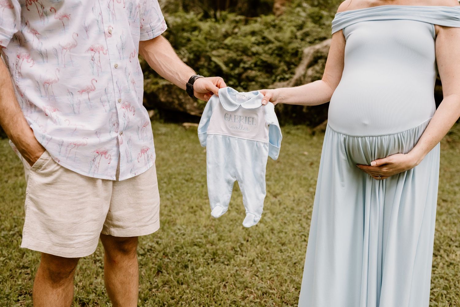 Casual outdoor family photography session with soft pastel tones.