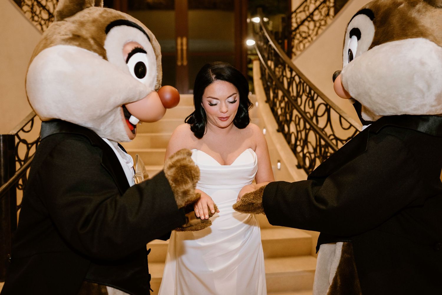 Chip and Dale mascots perform special dance with bride on wedding day.