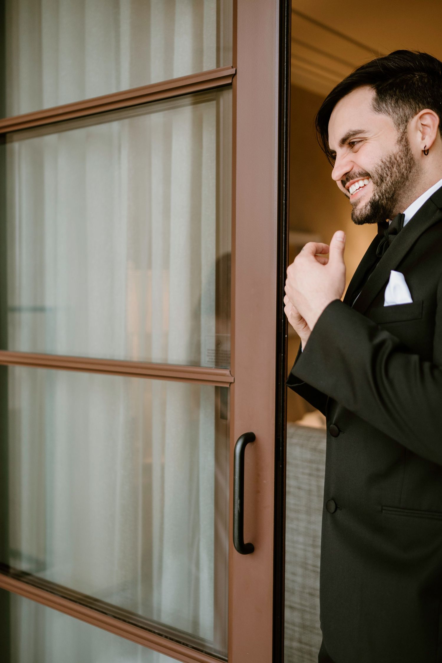 Groomsmen share laughs and smiles during pre-wedding moments.