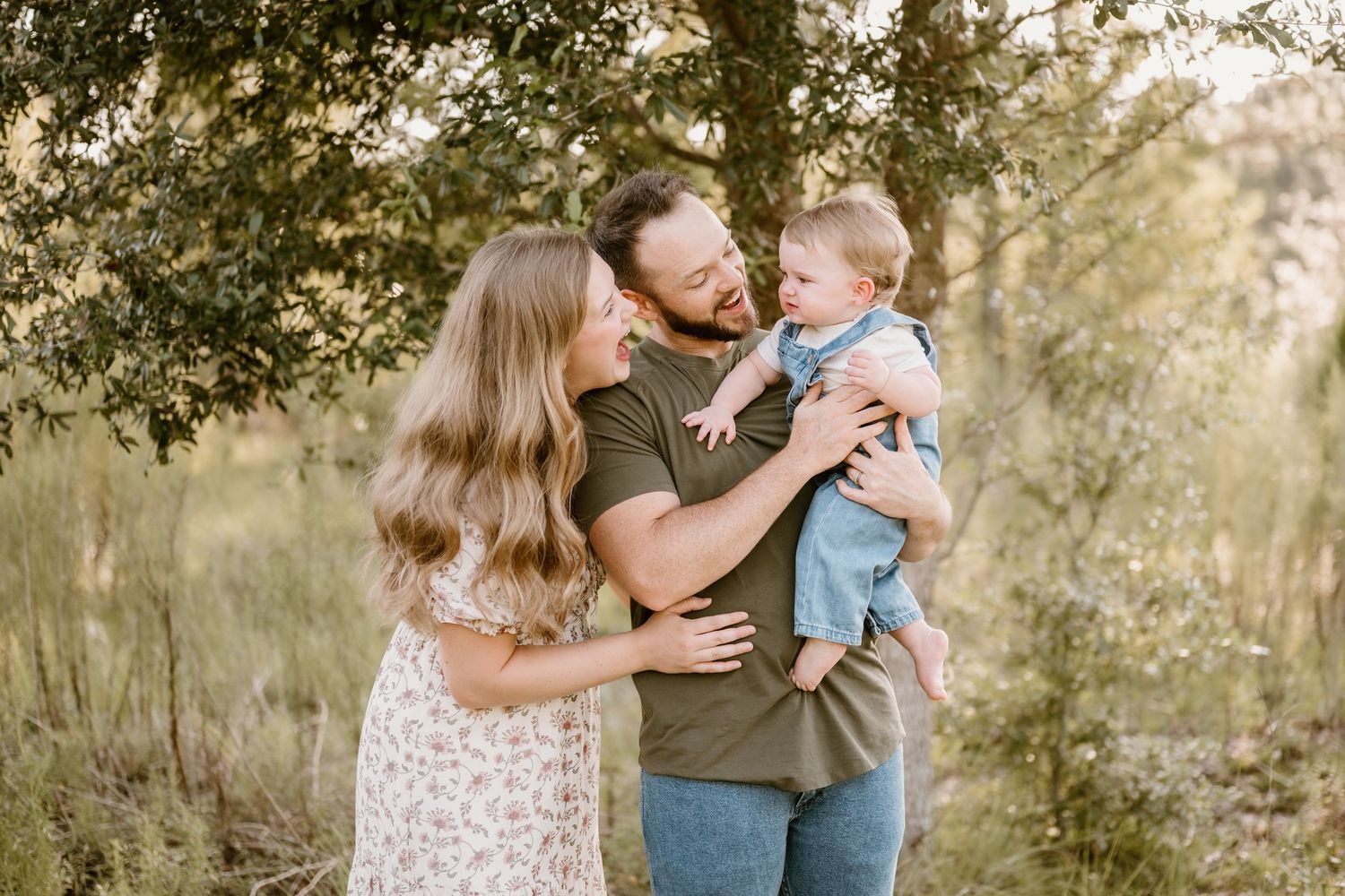 A sweet outdoor family portrait session captured in warm natural lighting.
