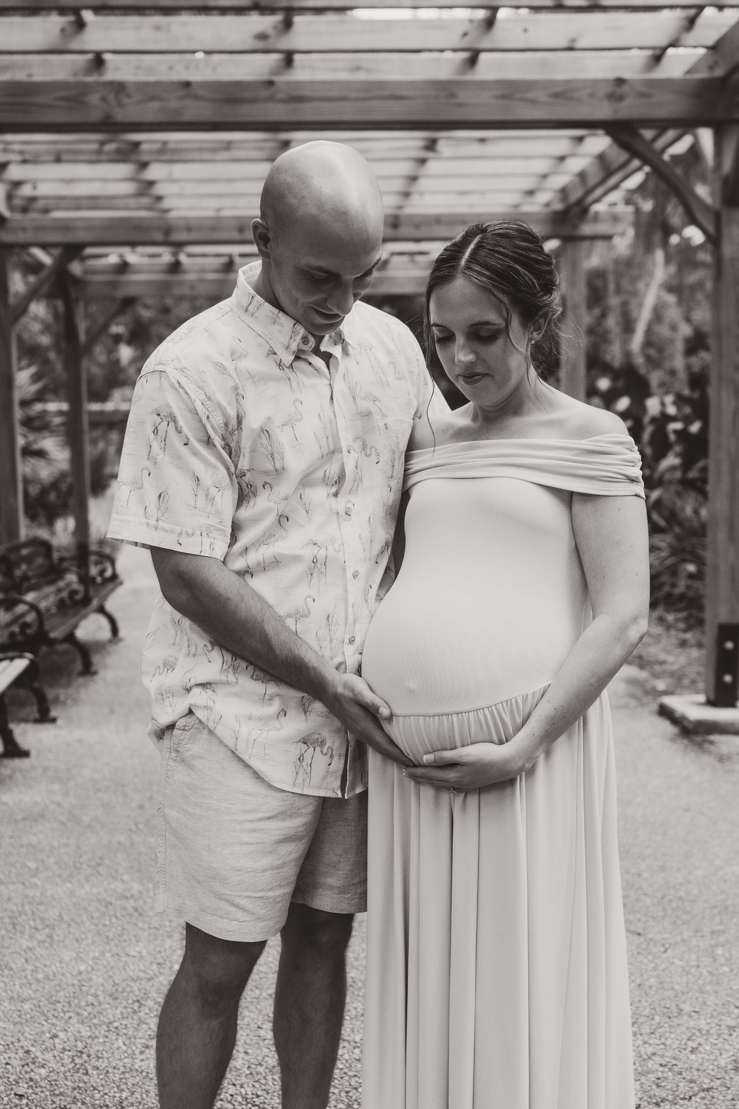 A heartwarming black and white family portrait session in a garden setting.