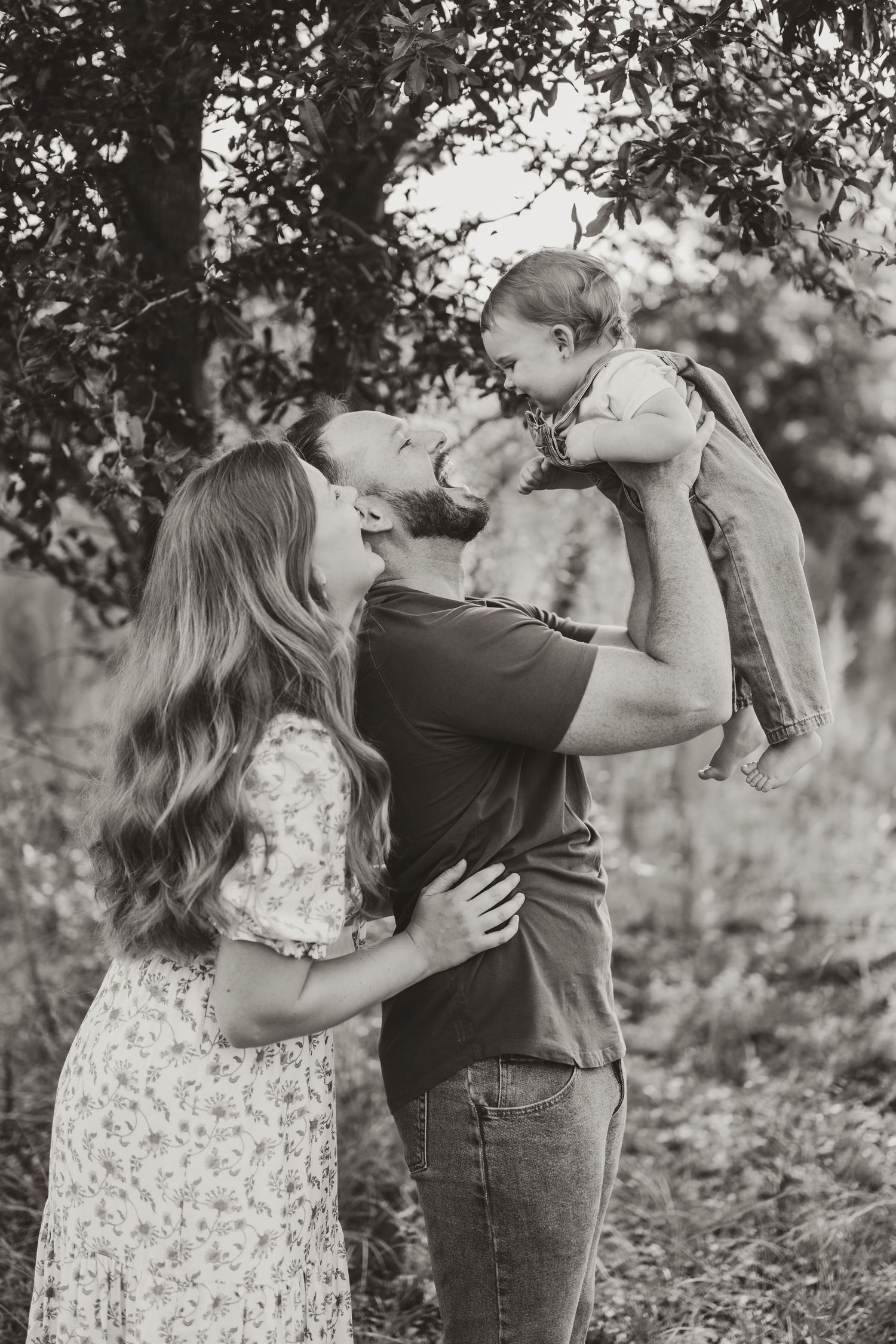 A series of candid family moments captured in black and white photography.