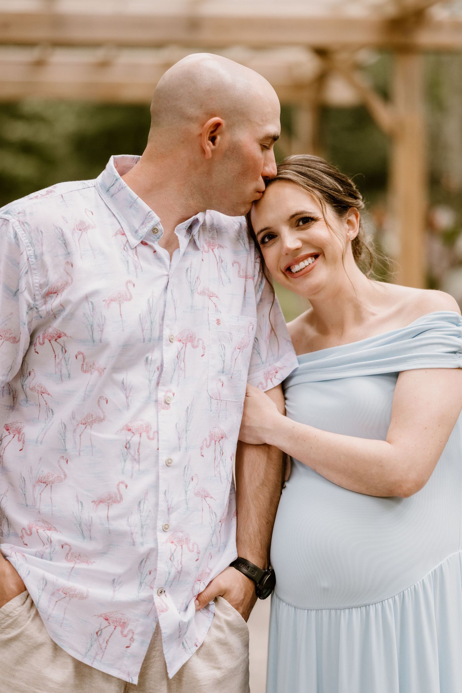 Romantic portrait series showing couple in light blue dress and floral shirt.