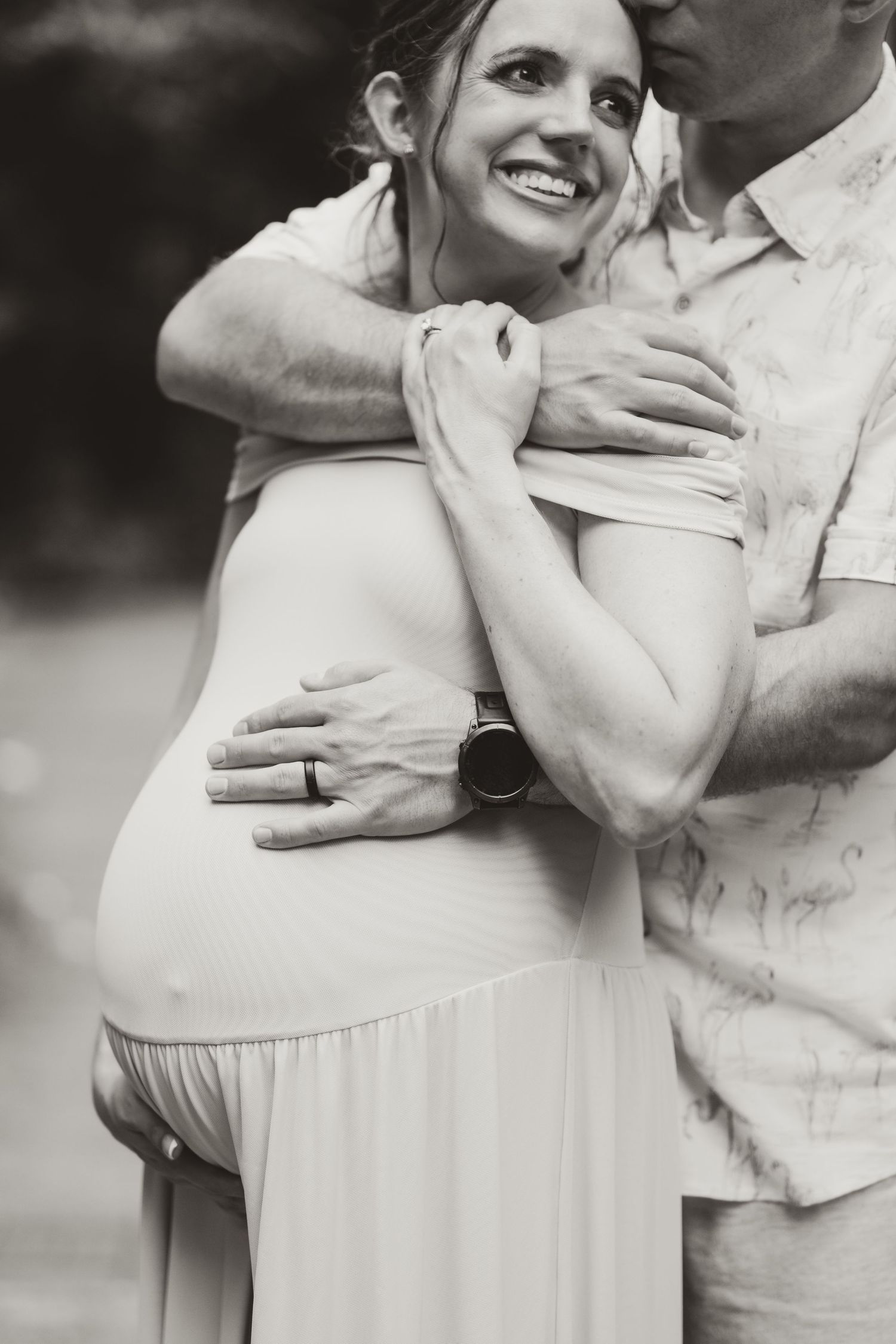 A couple shares an intimate embrace in a romantic outdoor photoshoot series.