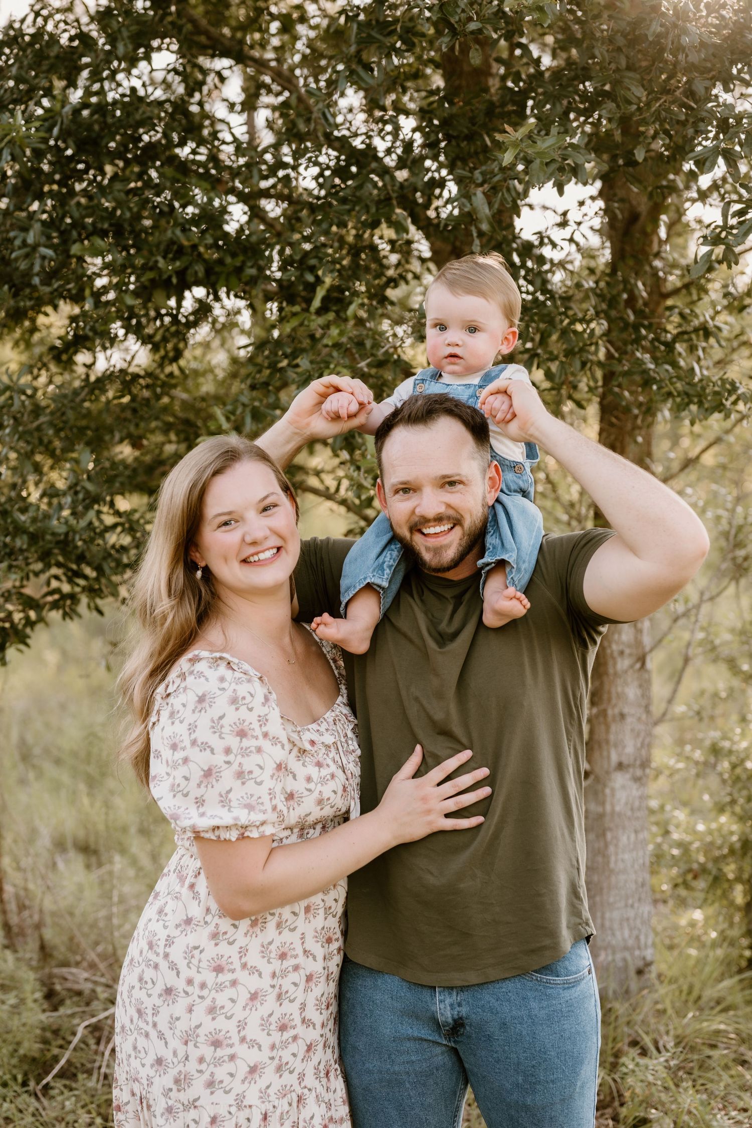 A joyful outdoor family portrait session captured in warm evening light.