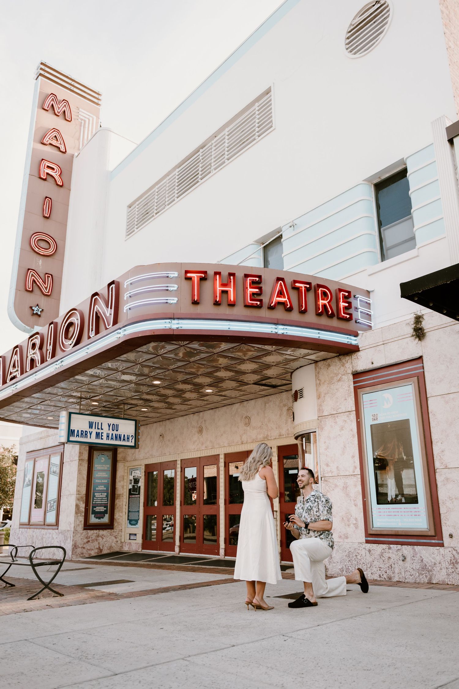 Vintage art deco movie theatre exterior with classic marquee and signage.