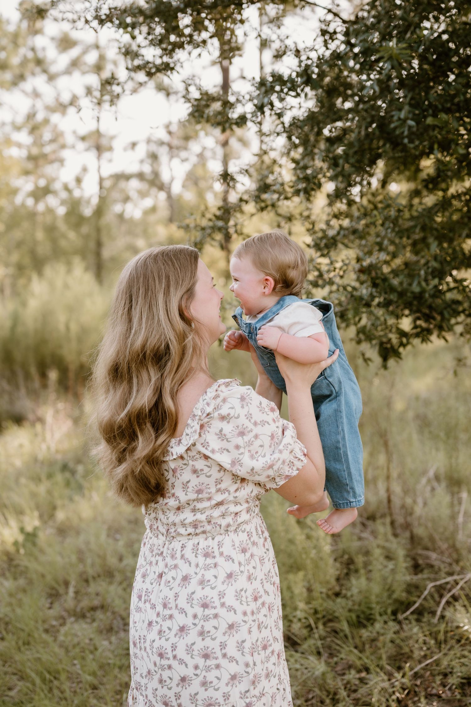 A family shares loving moments together in a sun-drenched outdoor setting.