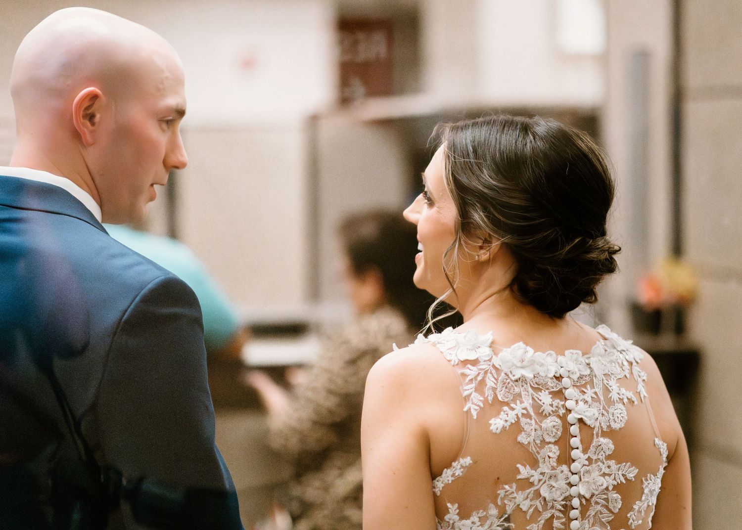 Close-up details of an elegant lace wedding dress back design.