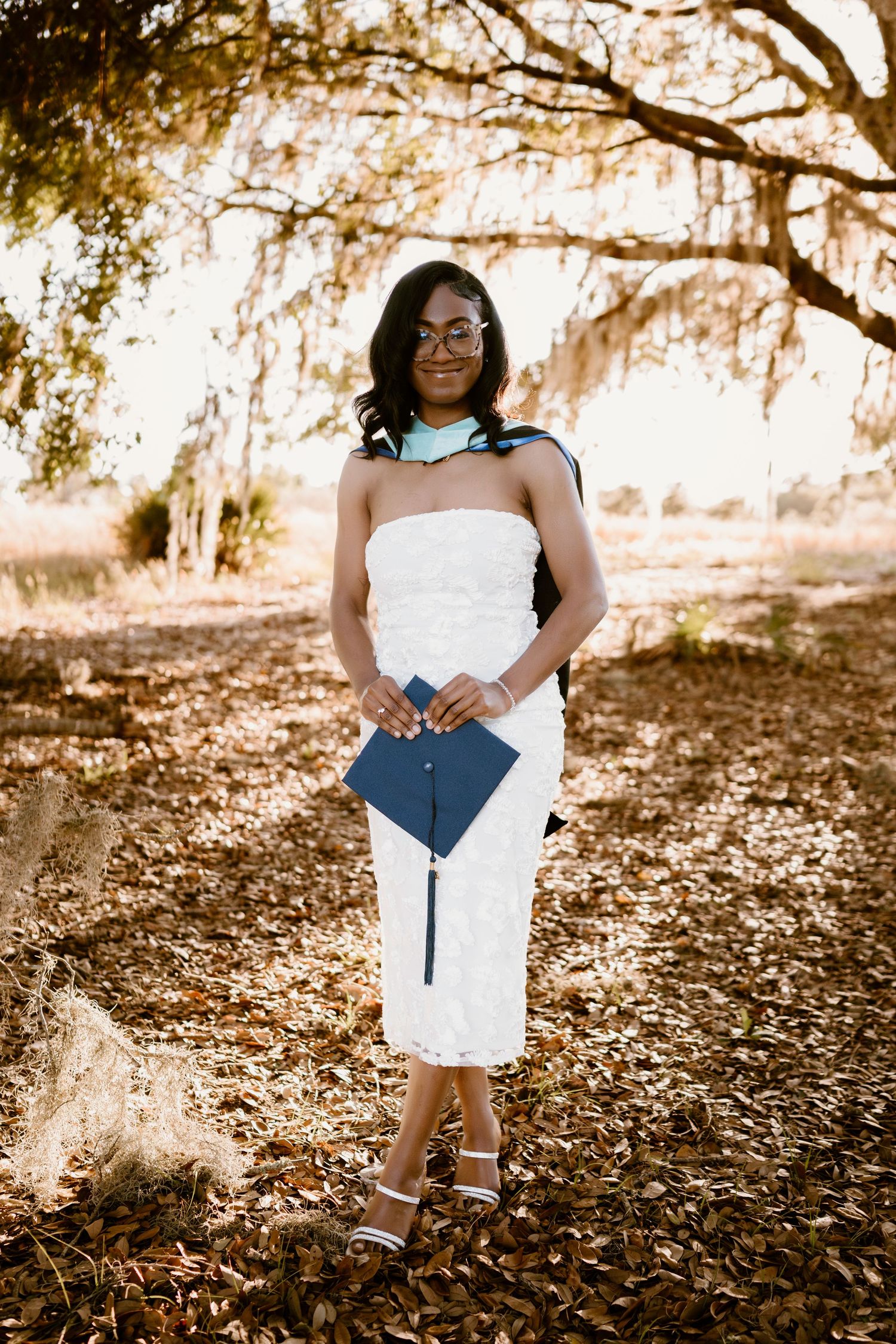 An autumn portrait session beneath Spanish moss-draped trees.