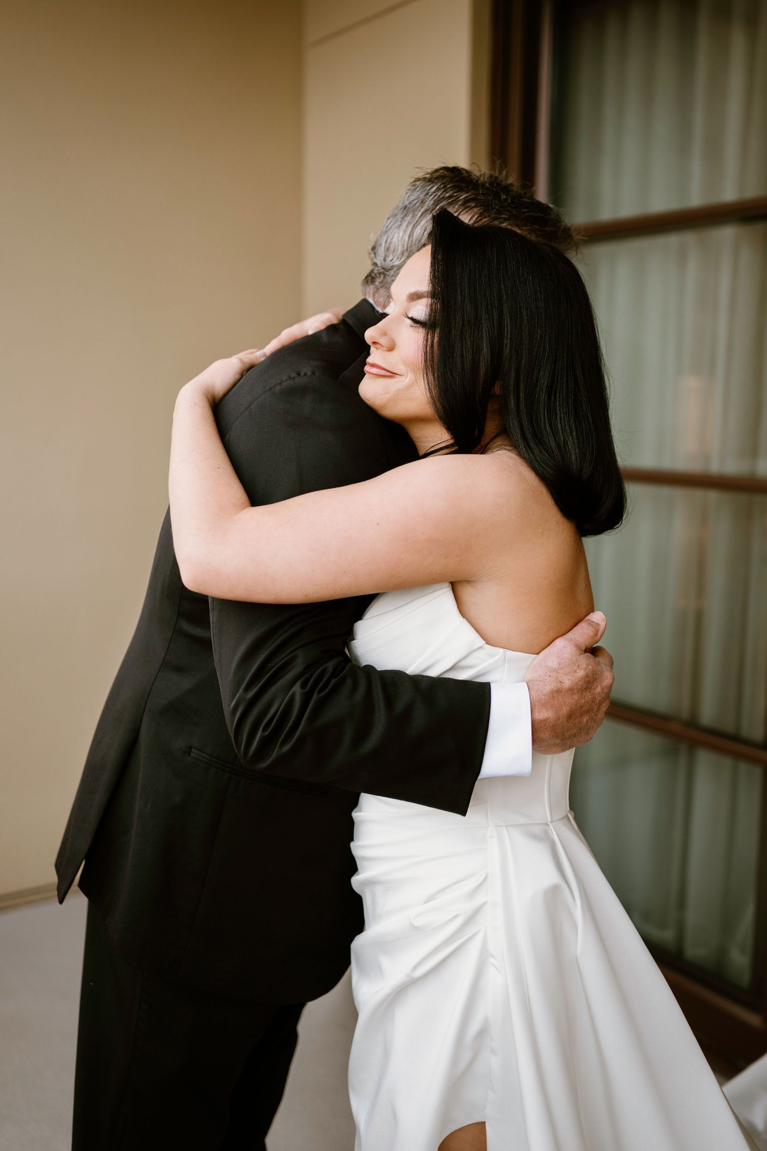 Emotional embrace sequence between couple during wedding first look moment.