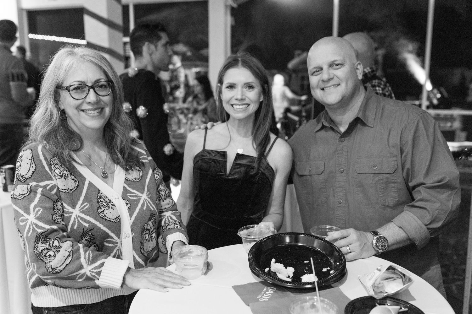 Group enjoying drinks and conversation at a social gathering.