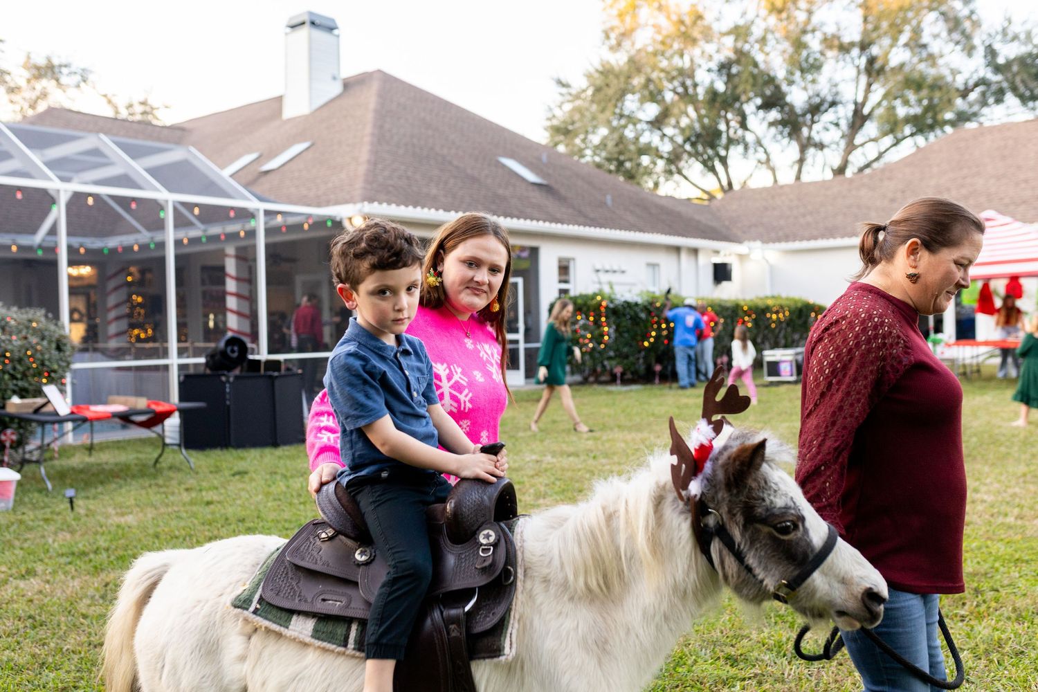 Guests enjoying outdoor activities and games at a holiday celebration.