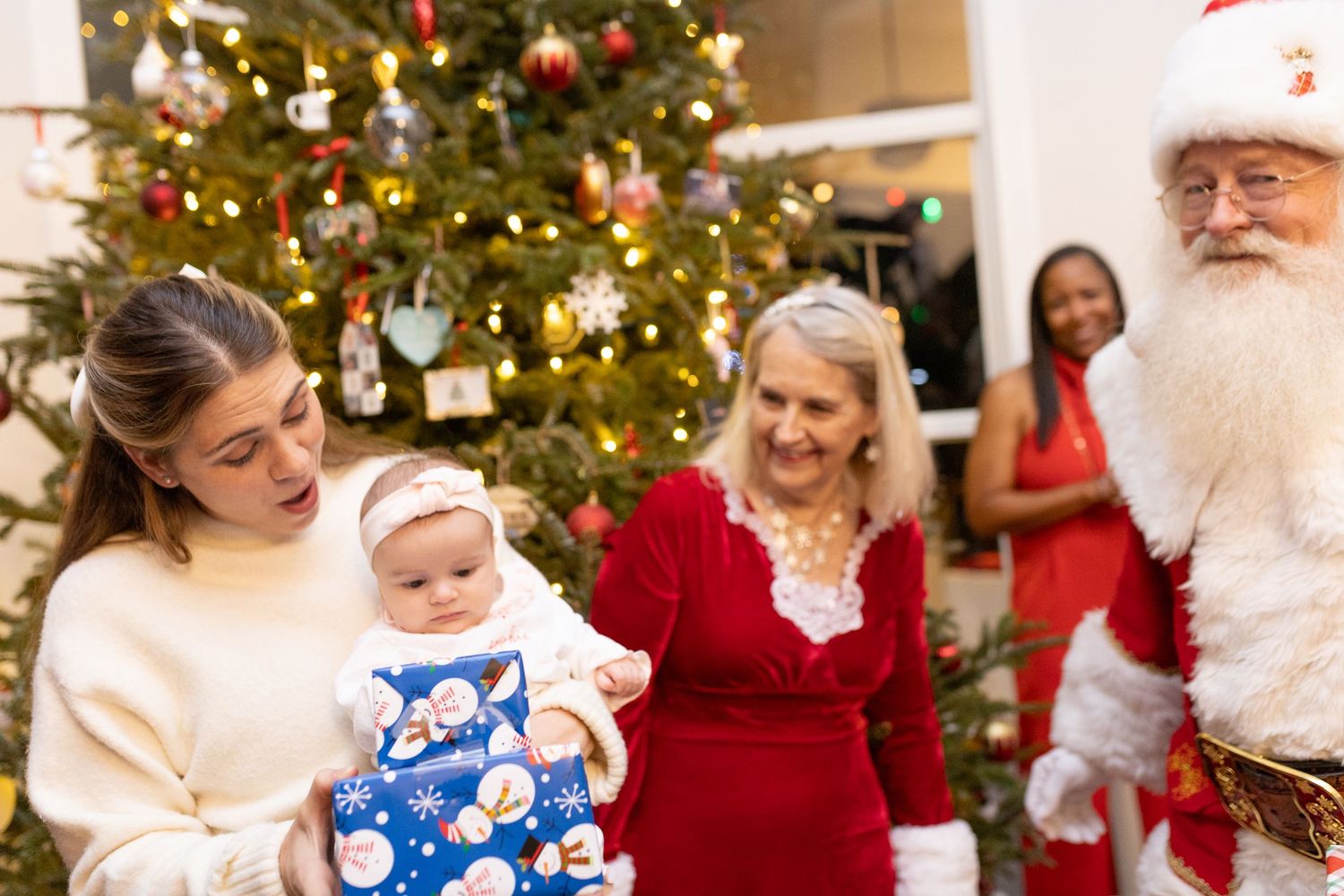 Christmas gathering with decorated evergreen trees and twinkling lights creating a magical atmosphere.
