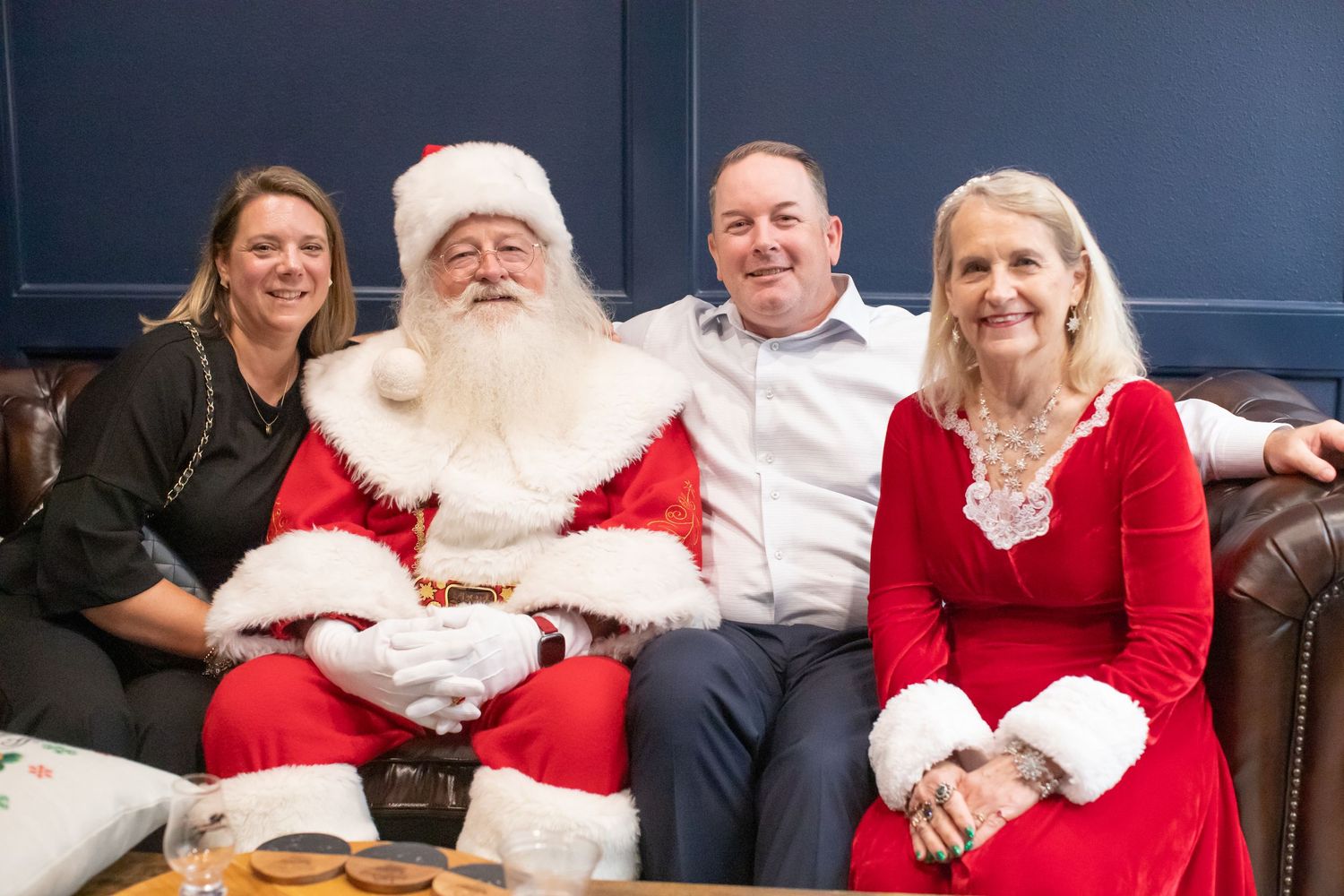 A festive holiday gathering in a cozy room with traditional Christmas decor.