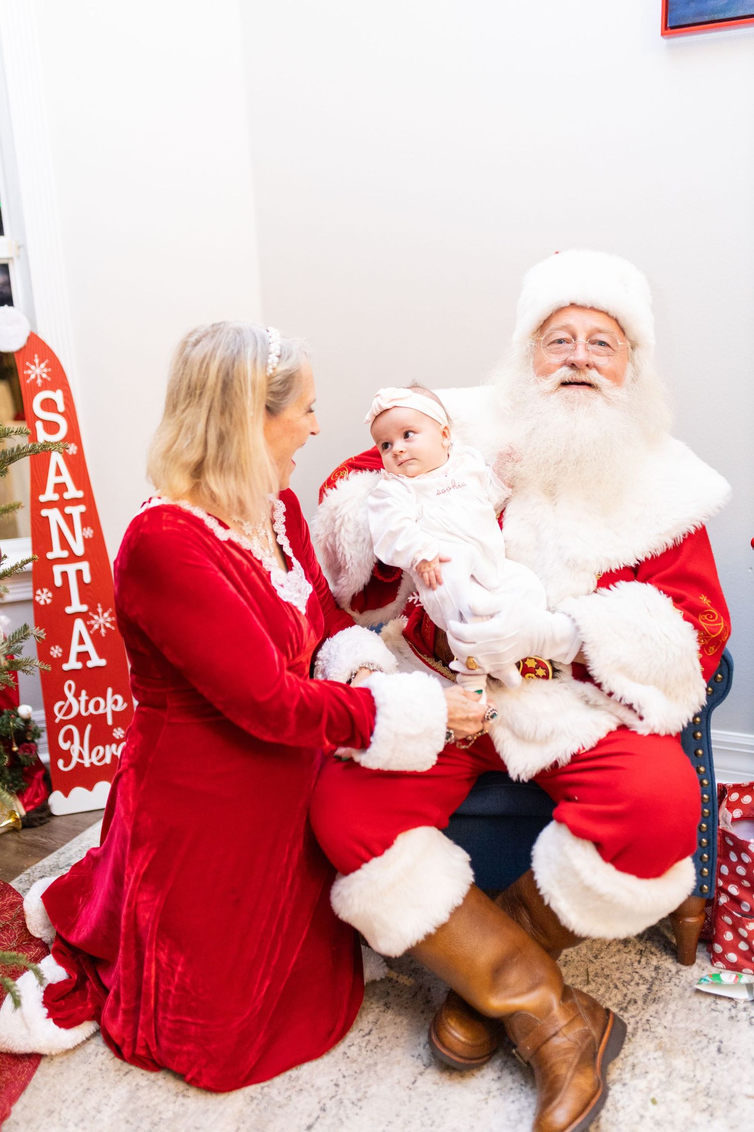 Candid Christmas photos with Santa featuring red and white holiday decorations.