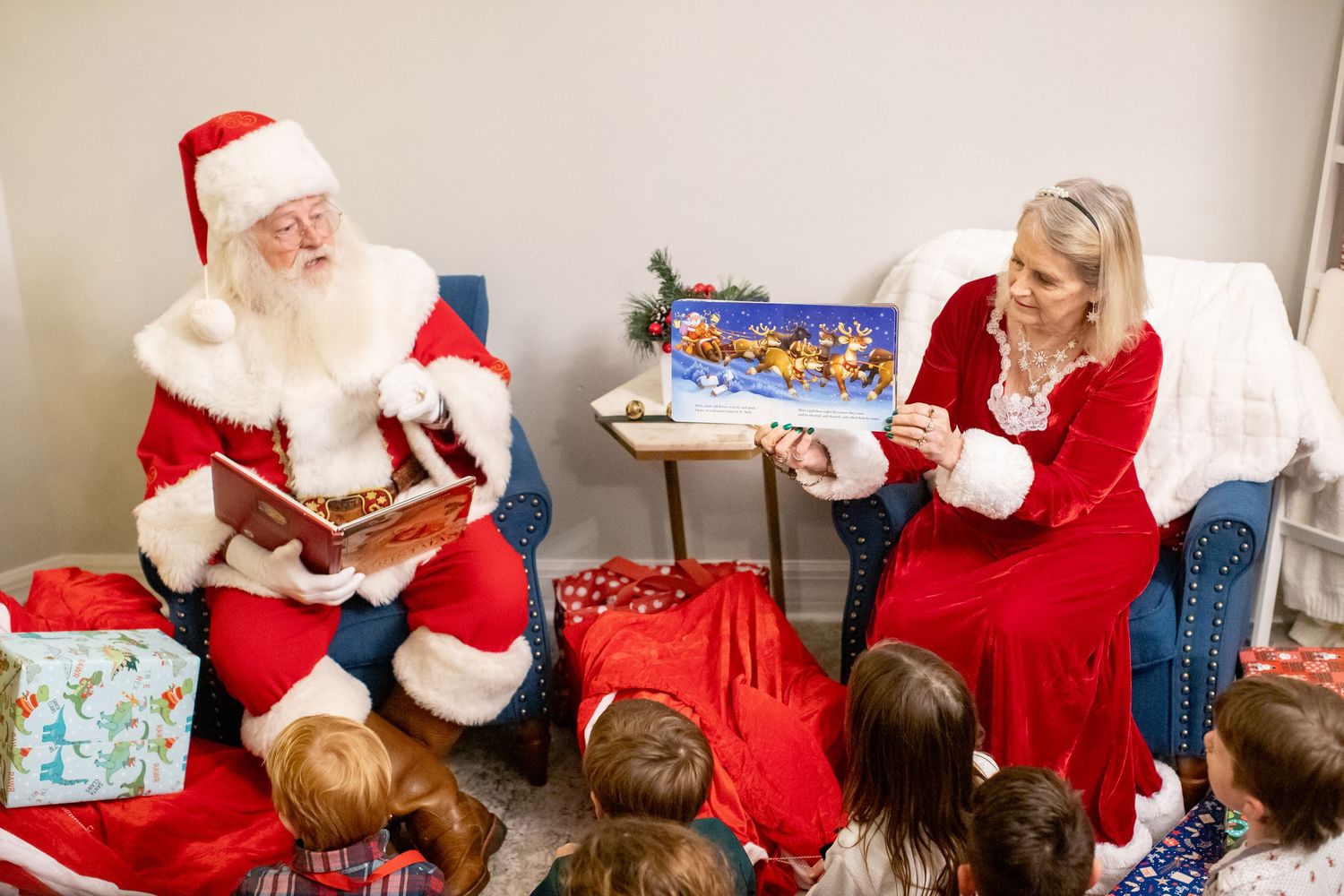 Holiday gathering with children meeting Santa Claus in a cozy indoor setting.
