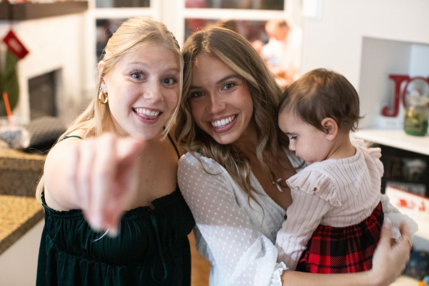 Candid indoor moments captured showing affectionate poses against a bright white background.