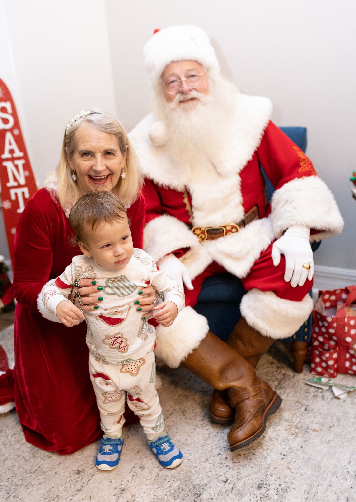 Candid moments of holiday joy captured during a Christmas photo session with Santa.