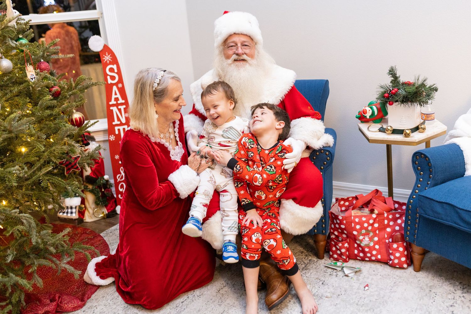 Festive holiday photo shoot with Christmas decorations and seasonal attire.