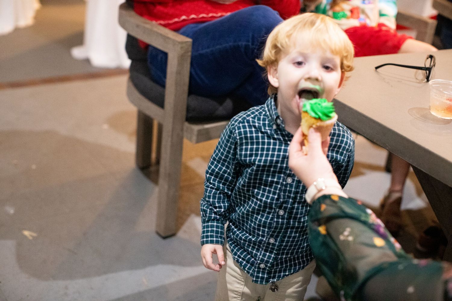 A series of candid holiday party moments showing children and festive decorations in a bright indoor setting.