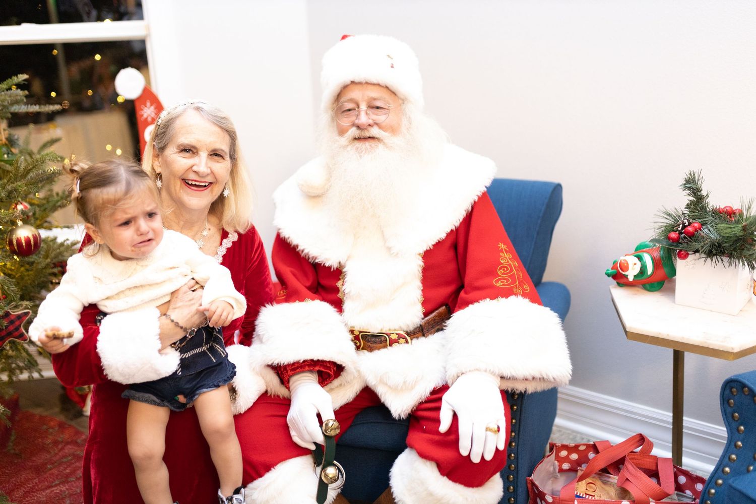 Candid holiday moments captured during a Christmas photo session with Santa.