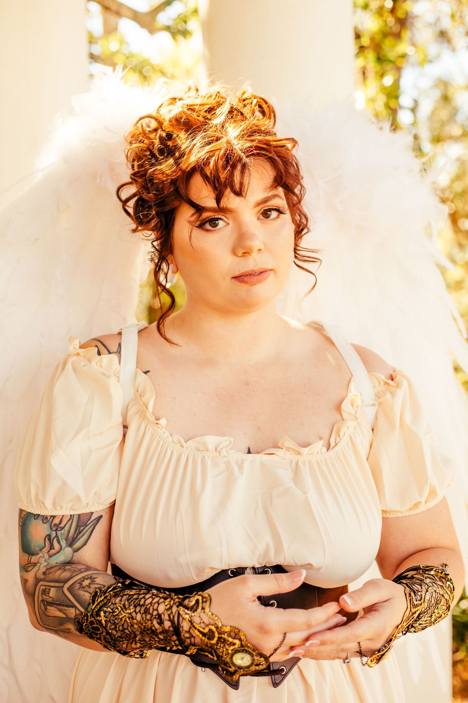 Romantic portrait series featuring delicate white dress and ornate gold accessories.