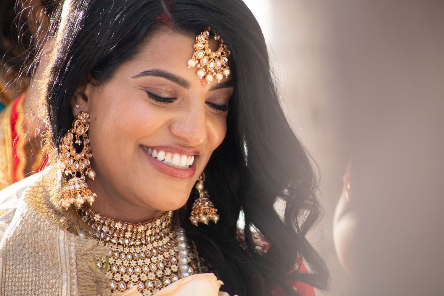 Close-up of ornate gold bridal jewelry and traditional wedding accessories.