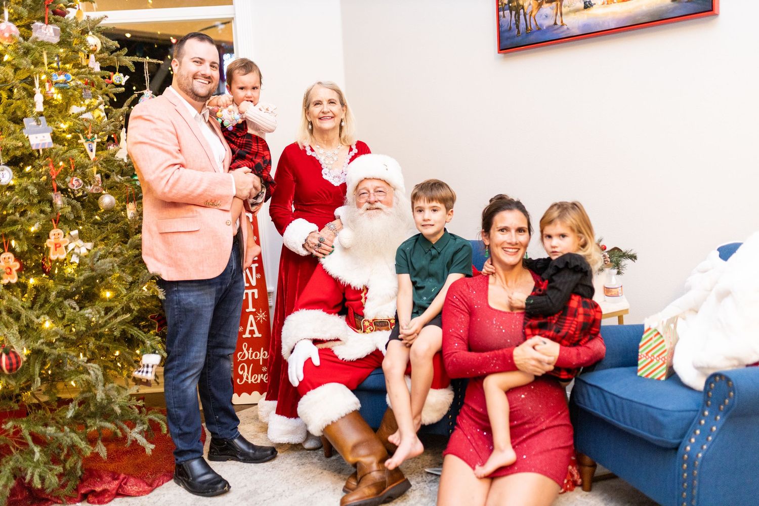 Festive family photo collection with Santa Claus and decorated Christmas backdrop.