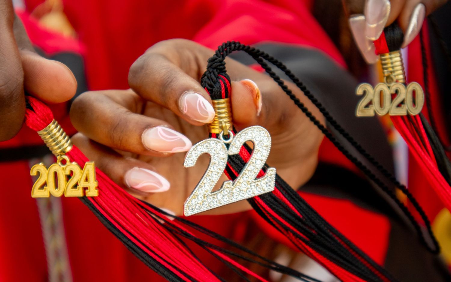 Close up of graduation tassel charm showing class of 2020 in gold numbers.