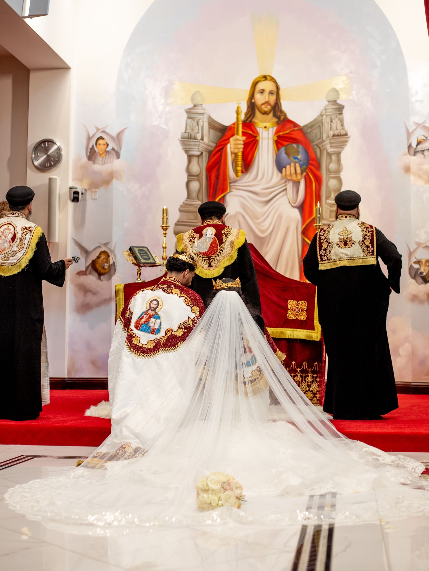 Traditional church wedding ceremony with ornate decorations and long flowing white dress.
