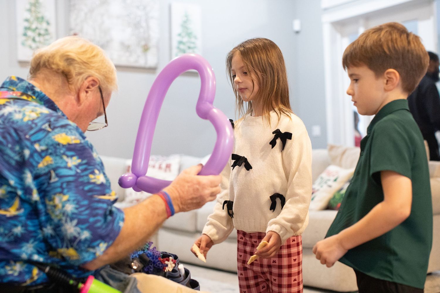 Children participating in a craft activity at a holiday event.