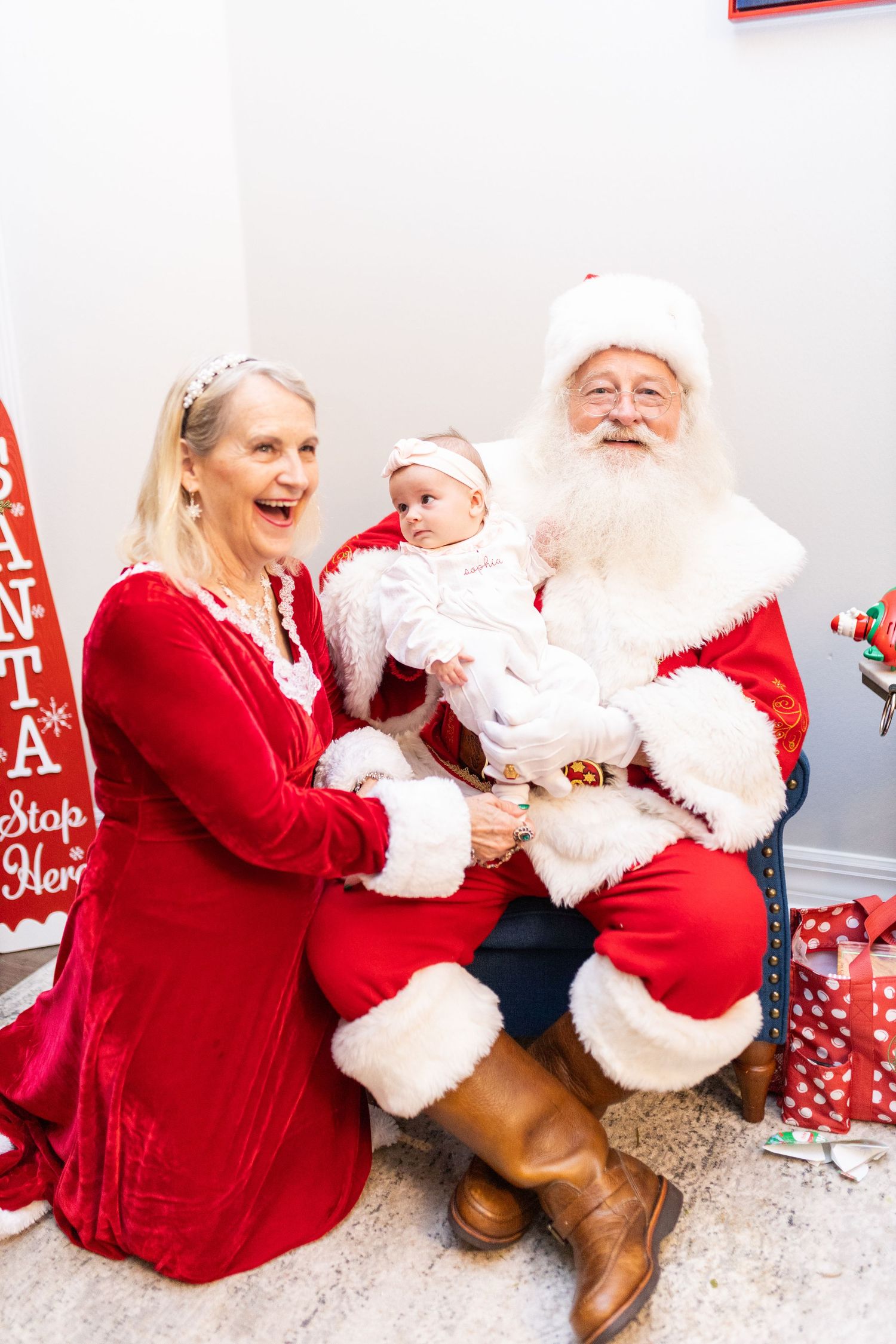 Festive photo session showing playful holiday moments against a white backdrop.