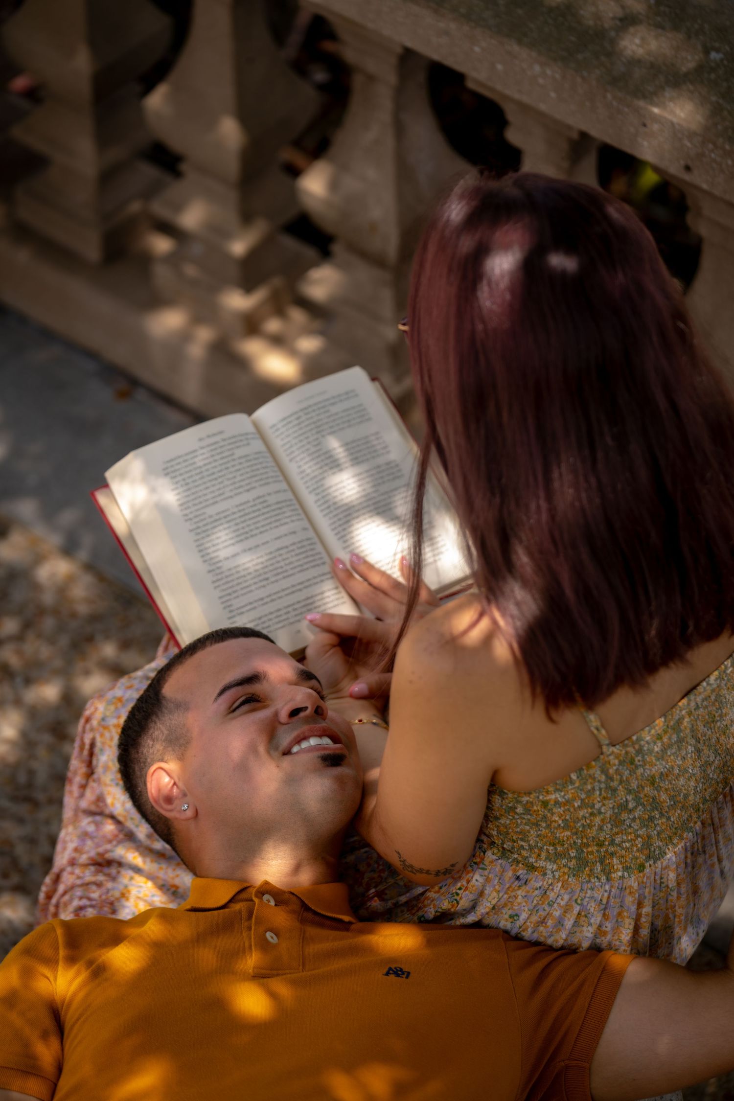 Wife holding and looking lovingly at her Husband in warm natural light.