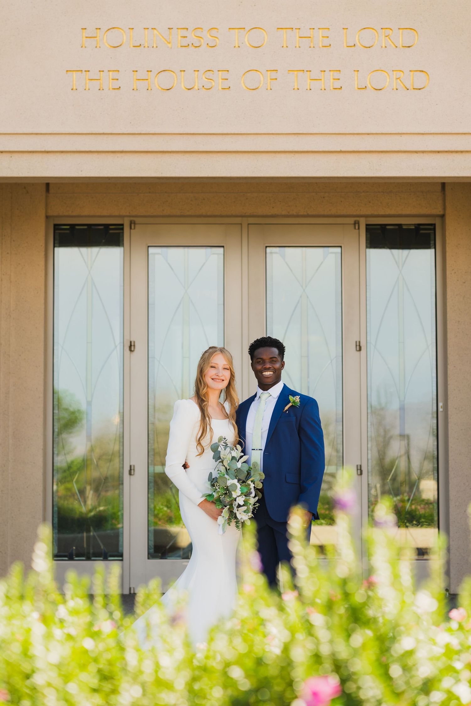 A bride and groom smiling after their wedding at the Gila Valley Temple.