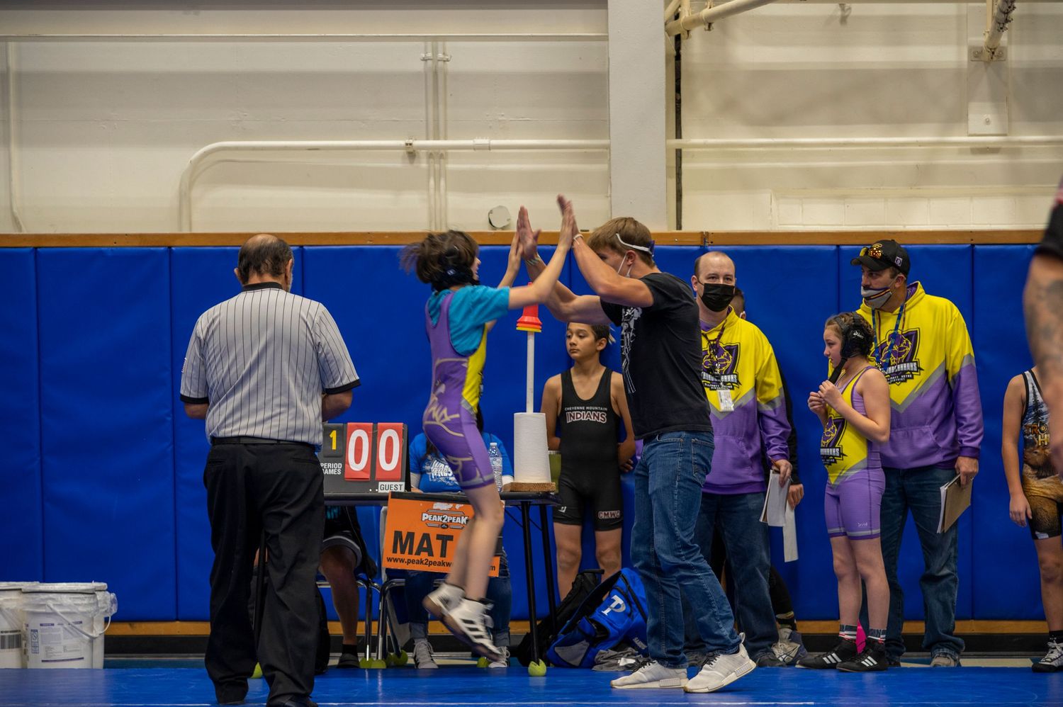 Capturing the emotion of a win for the wrestler and her coach