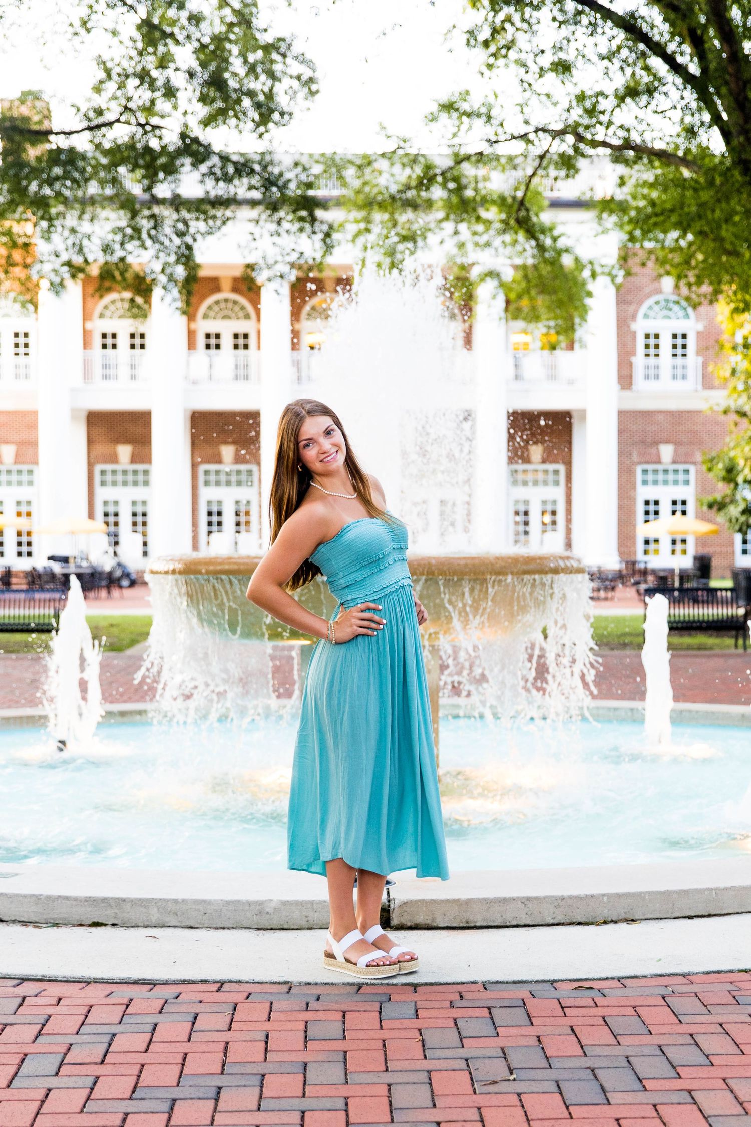 RVA Richmond Virginia senior photographer. Senior girl in blue dress standing in front of the Randolph Macon College fountain in Ashland.