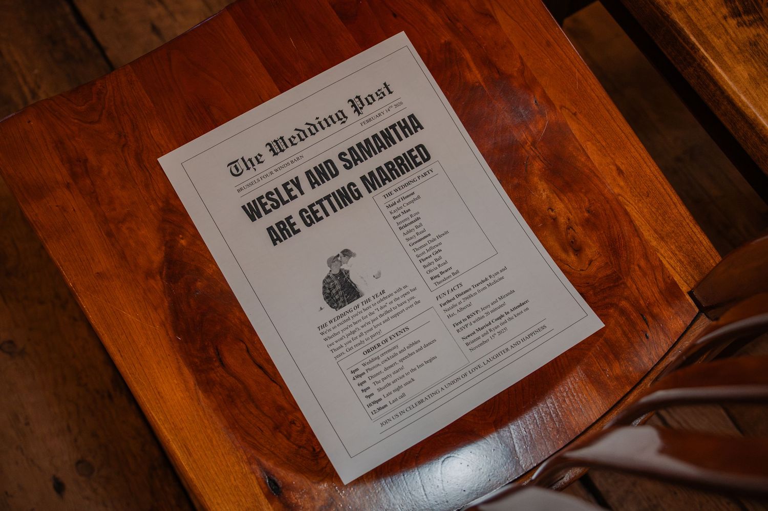 Wedding newspaper program for Wesley and Samantha's marriage announcement displayed on a wooden table.