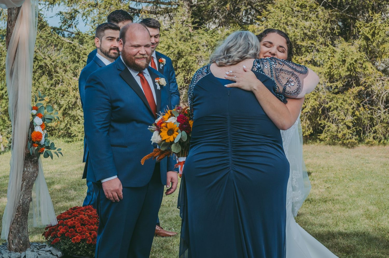 Emotional moment during outdoor wedding ceremony with mother of the bride.