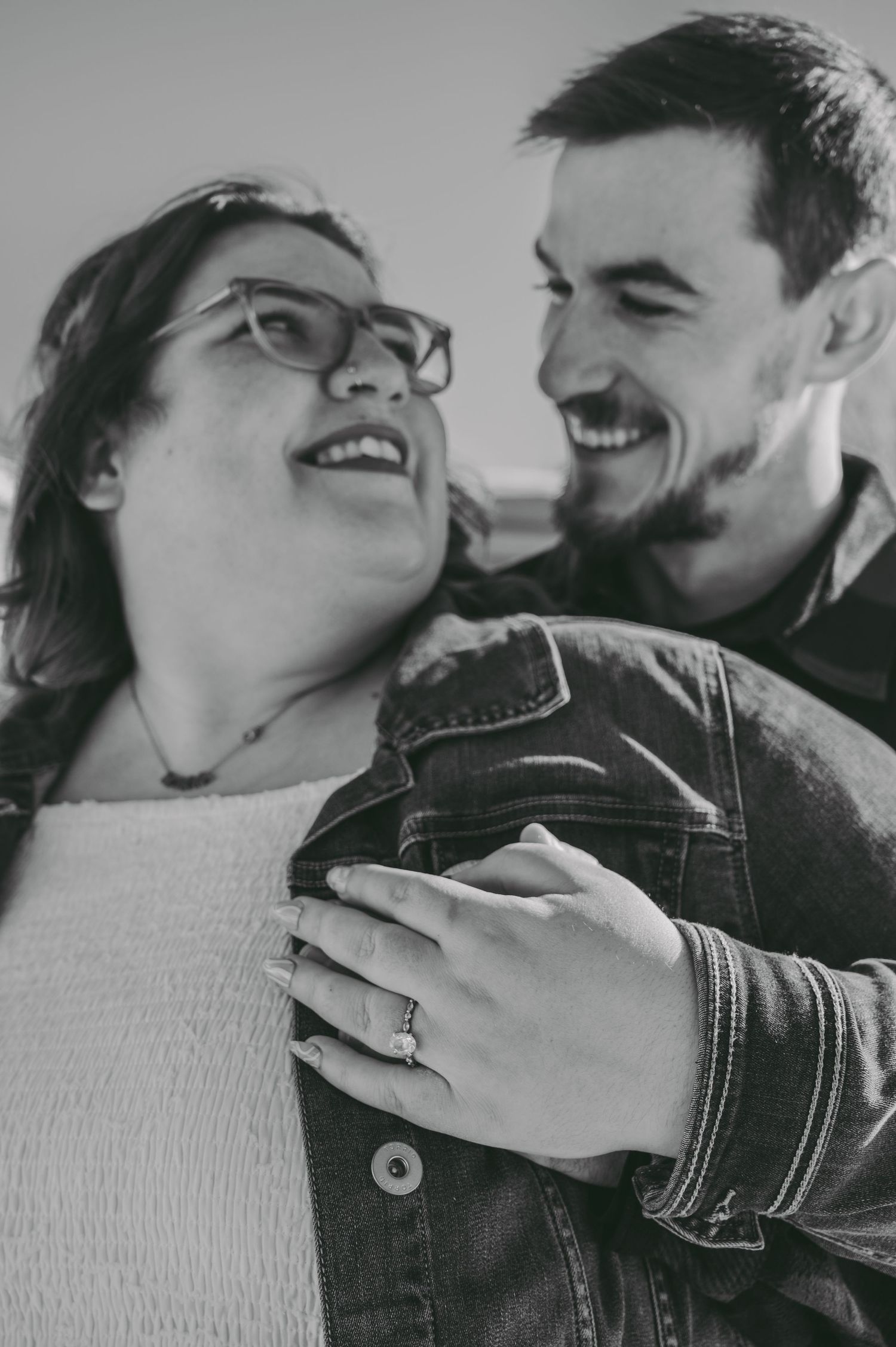 Close up of couple sharing intimate moment in black and white photography.